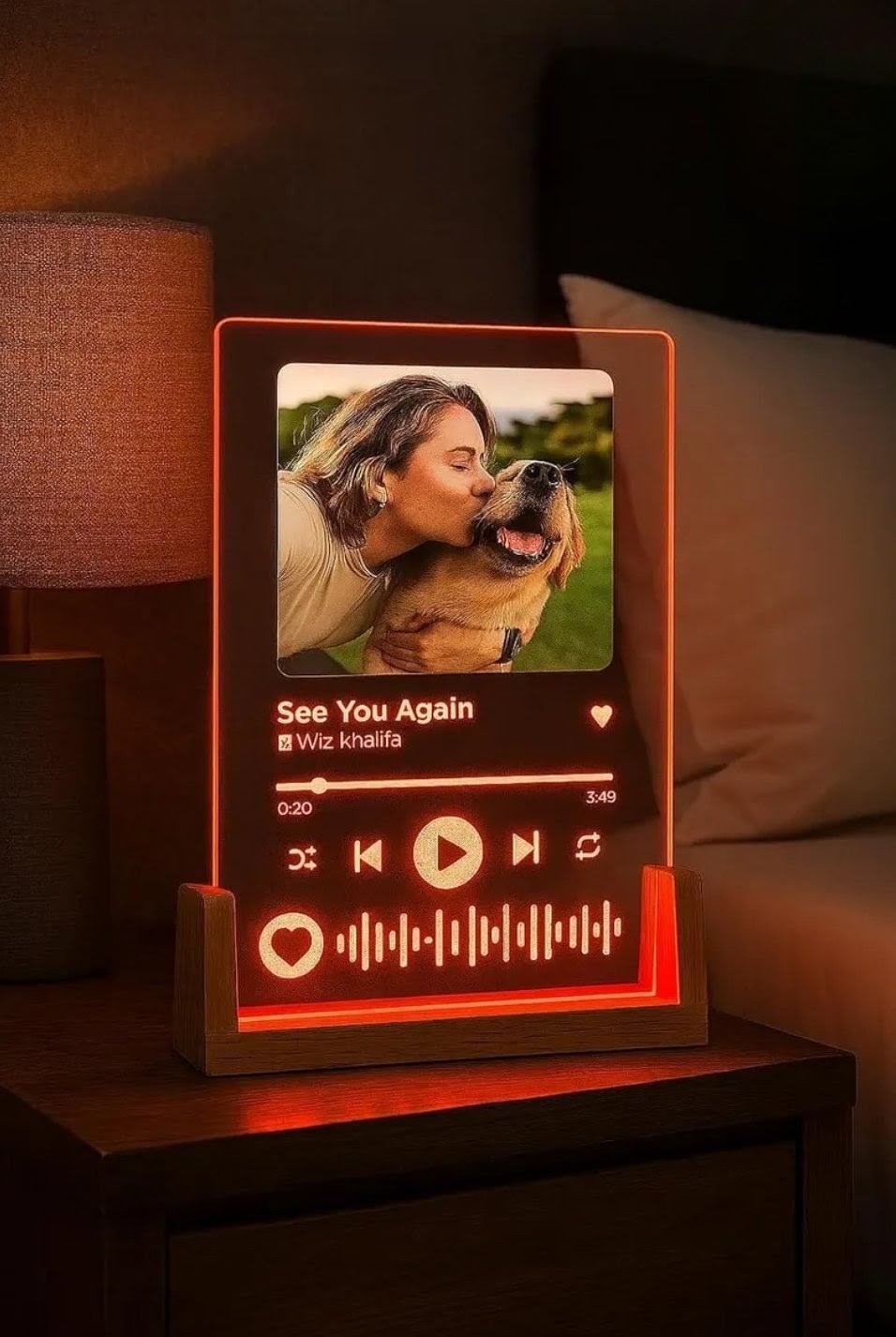 Personalised A5 acrylic song plaque glowing red on an LED wooden base